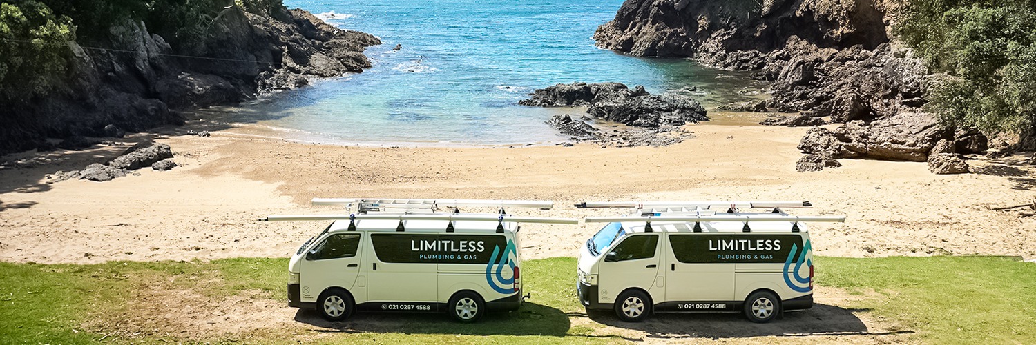 Limitless Plumbing and Gas - branded service vans on the Northland coast near Whangārei